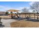 Community playground with shade structures at 45762 W Dirk St, Maricopa, AZ 85139