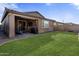 Large grassy backyard with covered patio at 4816 S 117Th Ave, Avondale, AZ 85323