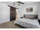 Main bedroom with barn door and ensuite bathroom access at 4816 S 117Th Ave, Avondale, AZ 85323