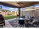 Covered patio with seating area and fire pit at 4816 S 117Th Ave, Avondale, AZ 85323