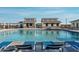 Community pool with lounge chairs and cabanas at 4816 S 117Th Ave, Avondale, AZ 85323