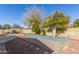 Landscaped backyard with trees and gravel pathway at 5210 W Ironwood Dr, Glendale, AZ 85302