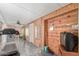 Sunroom features a treadmill, ceiling fan, and wood-paneled walls at 5210 W Ironwood Dr, Glendale, AZ 85302