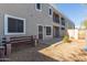 Small backyard with gravel, a bench, and building view at 5239 Rayanna Ct, Phoenix, AZ 85015