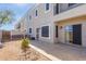 Backyard view of patio, building, and small landscaping at 5239 Rayanna Ct, Phoenix, AZ 85015