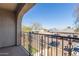 Private balcony overlooking parking lot and distant mountains at 5239 Rayanna Ct, Phoenix, AZ 85015