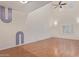 Living room with hardwood floors, high ceilings, and ceiling fan at 5239 Rayanna Ct, Phoenix, AZ 85015