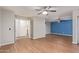 Bright living area with wood-look floors and ceiling fan at 5239 Rayanna Ct, Phoenix, AZ 85015