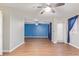 Living room with wood-look floors and blue accent wall at 5239 Rayanna Ct, Phoenix, AZ 85015