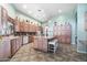 Large kitchen with an island, wood cabinets, and tile backsplash at 5540 E Shea Blvd, Scottsdale, AZ 85254