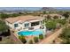 Aerial view showcasing a pool, patio, and mountain views at 6015 E Calle De Las Estrellas --, Cave Creek, AZ 85331