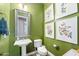 Powder room with pedestal sink and green walls at 6015 E Calle De Las Estrellas --, Cave Creek, AZ 85331