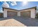 Spacious two-car garage with neutral-colored doors and a paved driveway at 6015 E Calle De Las Estrellas --, Cave Creek, AZ 85331