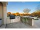 Outdoor kitchen features built-in grill, bar seating, and desert landscape views at 6015 E Calle De Las Estrellas --, Cave Creek, AZ 85331