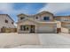 Two story home with a two car garage and desert landscaping at 6102 S 37Th Ln, Phoenix, AZ 85041