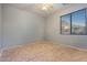 Simple bedroom with ceiling fan and carpet at 6233 W Maya Dr, Phoenix, AZ 85083