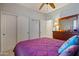 Bedroom with ceiling fan and dresser at 6233 W Maya Dr, Phoenix, AZ 85083