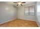 Bright bedroom featuring tile floors and window blinds at 6233 W Maya Dr, Phoenix, AZ 85083