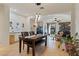 Dining room with dark wood table and seating for four at 6233 W Maya Dr, Phoenix, AZ 85083