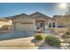 Charming single-story home with a two-car garage and stone accents at 6233 W Maya Dr, Phoenix, AZ 85083