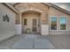 Front entry with stone accents and a security door at 6233 W Maya Dr, Phoenix, AZ 85083