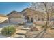 Single-story home with stone accents and landscaped front yard at 6233 W Maya Dr, Phoenix, AZ 85083