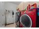 Laundry room with washer, dryer, and storage cabinets at 6233 W Maya Dr, Phoenix, AZ 85083