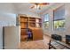 Home office with built-in shelving and large windows at 6233 W Maya Dr, Phoenix, AZ 85083