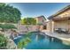 Stunning pool and spa with waterfall feature and patio at 6233 W Maya Dr, Phoenix, AZ 85083