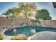 Relaxing kidney-shaped pool and spa at 6233 W Maya Dr, Phoenix, AZ 85083