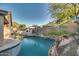 Stunning pool with a built-in fire pit at 6233 W Maya Dr, Phoenix, AZ 85083