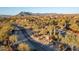 Aerial view of community entrance and surrounding mountain landscape at 6251 E Bramble Berry Ln, Cave Creek, AZ 85331