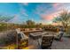 Spacious backyard patio with firepit and seating area, perfect for outdoor entertaining at 6251 E Bramble Berry Ln, Cave Creek, AZ 85331