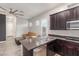 Open concept kitchen with island seating and stainless steel appliances at 6251 E Bramble Berry Ln, Cave Creek, AZ 85331