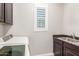 Convenient laundry room with washer, dryer, and a sink at 6251 E Bramble Berry Ln, Cave Creek, AZ 85331