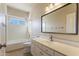 Well-lit bathroom showcasing a vanity, bathtub with shower, and neutral color palette at 638 W Nido Ave, Mesa, AZ 85210