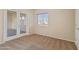 A bright bedroom with french doors leading to another room, neutral carpet, and lots of light at 638 W Nido Ave, Mesa, AZ 85210