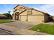 Charming two-story home featuring a large three car garage and well-maintained lawn at 638 W Nido Ave, Mesa, AZ 85210