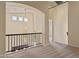 Open hallway featuring neutral carpet and a view of the chandelier and open floor plan at 638 W Nido Ave, Mesa, AZ 85210