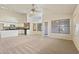 Bright, open living space featuring tiled dining area and carpeted living area at 638 W Nido Ave, Mesa, AZ 85210