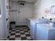 Shared laundry room with coin-operated washers and dryers at 720 N 82Nd St # E210, Scottsdale, AZ 85257