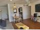 Living room with wood floors, dining area, and kitchen view at 720 N 82Nd St # E210, Scottsdale, AZ 85257