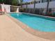 Community swimming pool with surrounding patio furniture at 720 N 82Nd St # E210, Scottsdale, AZ 85257