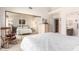 Bright bedroom with mirrored closet doors and a rocking chair at 7373 S Bonarden Ln, Tempe, AZ 85283