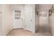 Home entryway with white doors, tile flooring, and a view of hallway at 7373 S Bonarden Ln, Tempe, AZ 85283