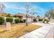 House exterior showcasing tan stucco, tile roof, and landscaping at 7373 S Bonarden Ln, Tempe, AZ 85283