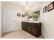 Small kitchen nook with dark brown cabinets and a window at 7373 S Bonarden Ln, Tempe, AZ 85283