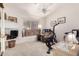 Home office space with built-in shelving and exercise bike at 7373 S Bonarden Ln, Tempe, AZ 85283