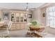 Dining room with wood table and chairs, and built-in hutch at 7807 E Main St # Cc-106, Mesa, AZ 85207