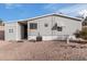 Gray mobile home with landscaped yard at 7807 E Main St # Cc-106, Mesa, AZ 85207